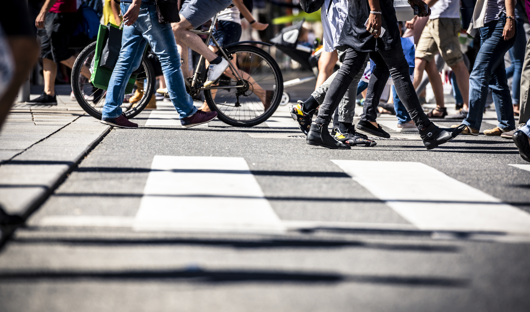 Pedestrians crossing a busy street