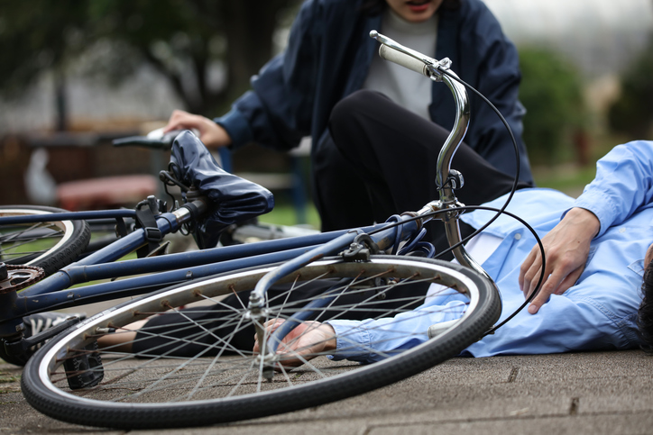 Injured cyclist on the ground