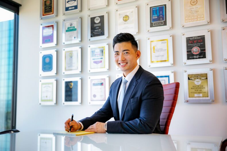 Daniel Kim sitting in conference room