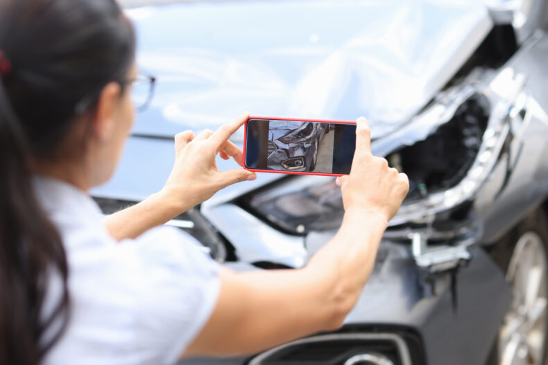Taking a photo of car crash