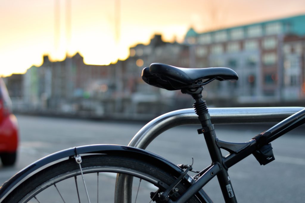Close up of bicycle against city background