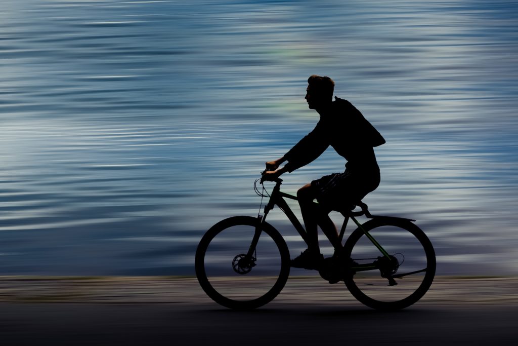 Bicyclist cycling blurred background
