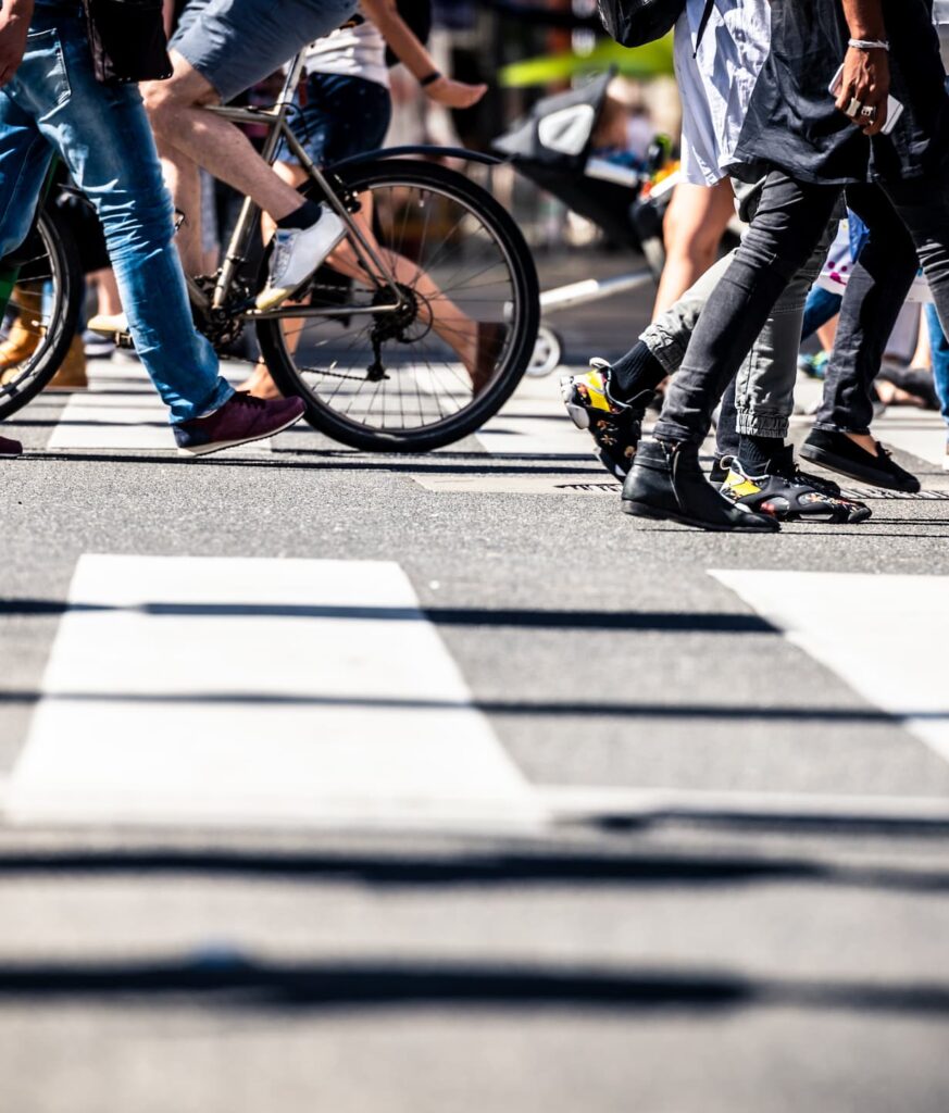 Pedestrians crossing at crosswalk