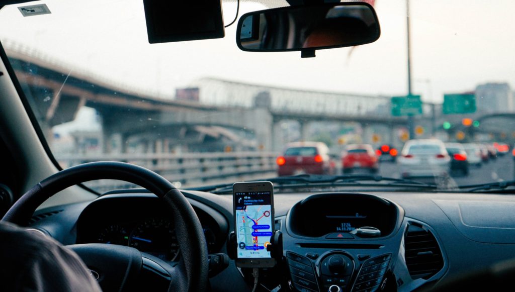 Drivers looking distressed next to damaged vehicles
