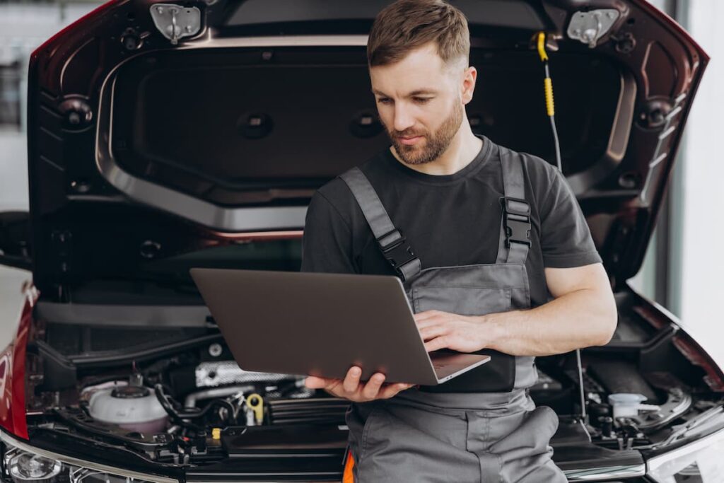 Technician retrieving vehicle data