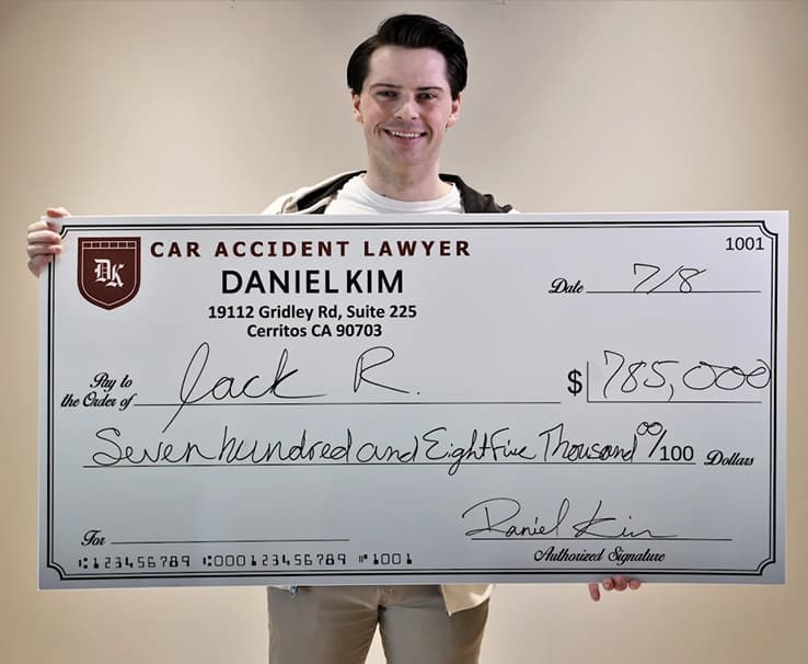 DK Law Client Image with a Jumbo Check of $785,000