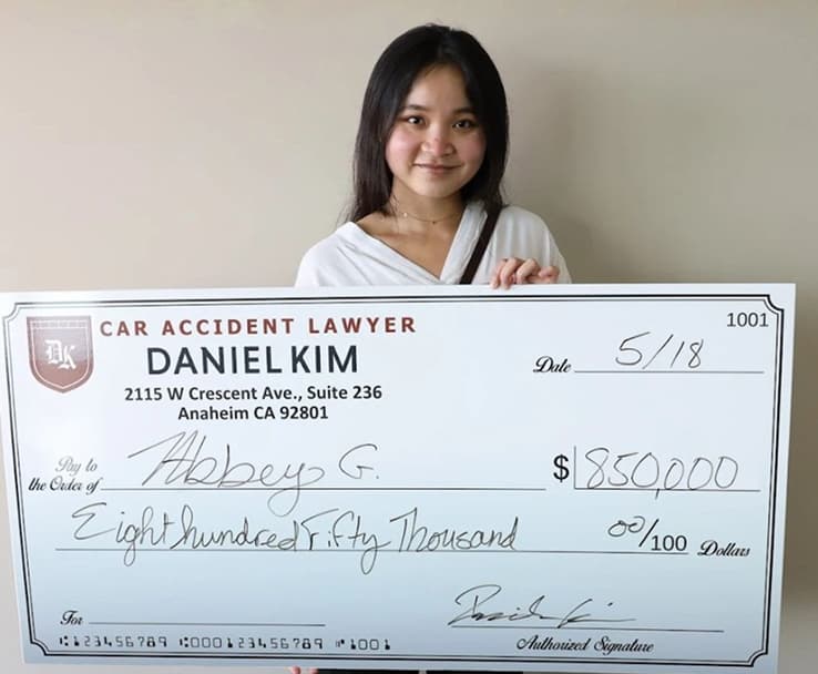 DK Law Client Image with a Jumbo Check of $850,000