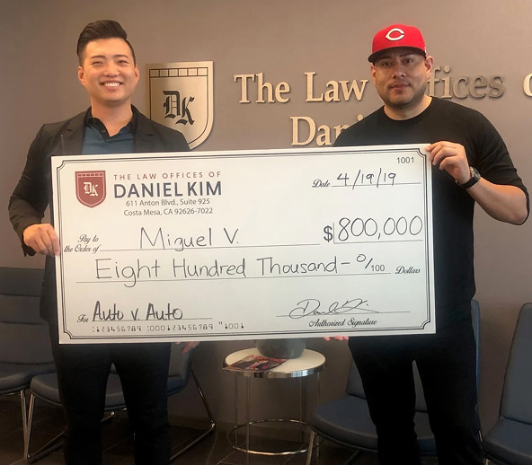DK Law Client with check Costa Mesa