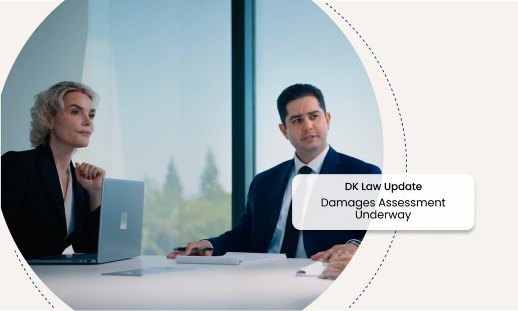DK Law attorneys in a meeting with text 'DK Law Update - Damages assessment underway'.