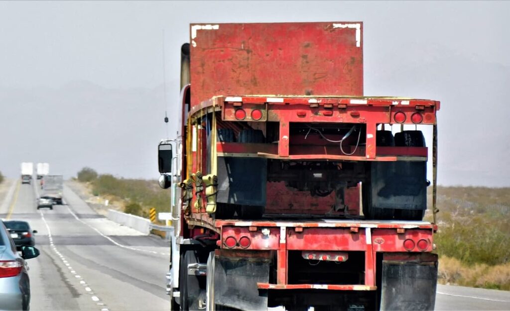 A double decker red truck