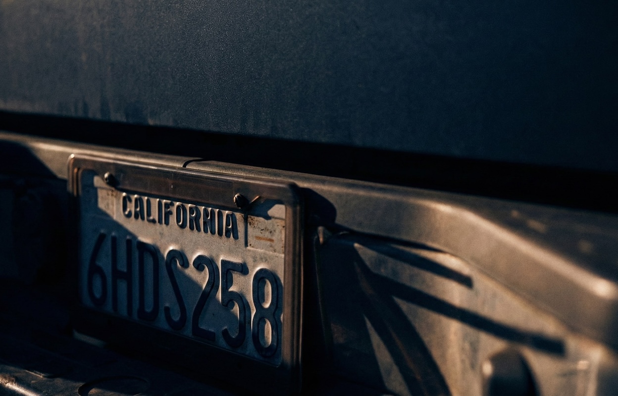 close up of a California license plate on the back of a vehicle