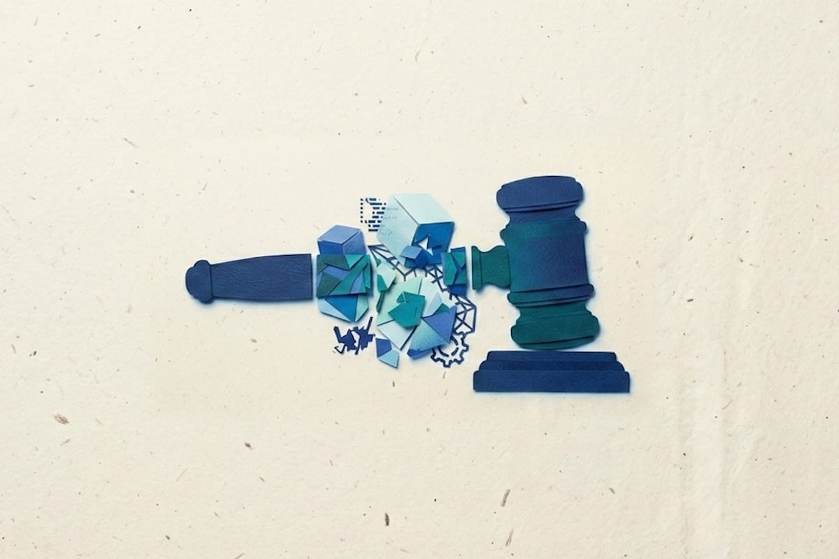 A paper craft gavel breaking apart into digital fragments illustrating the impact of AI on the legal industry